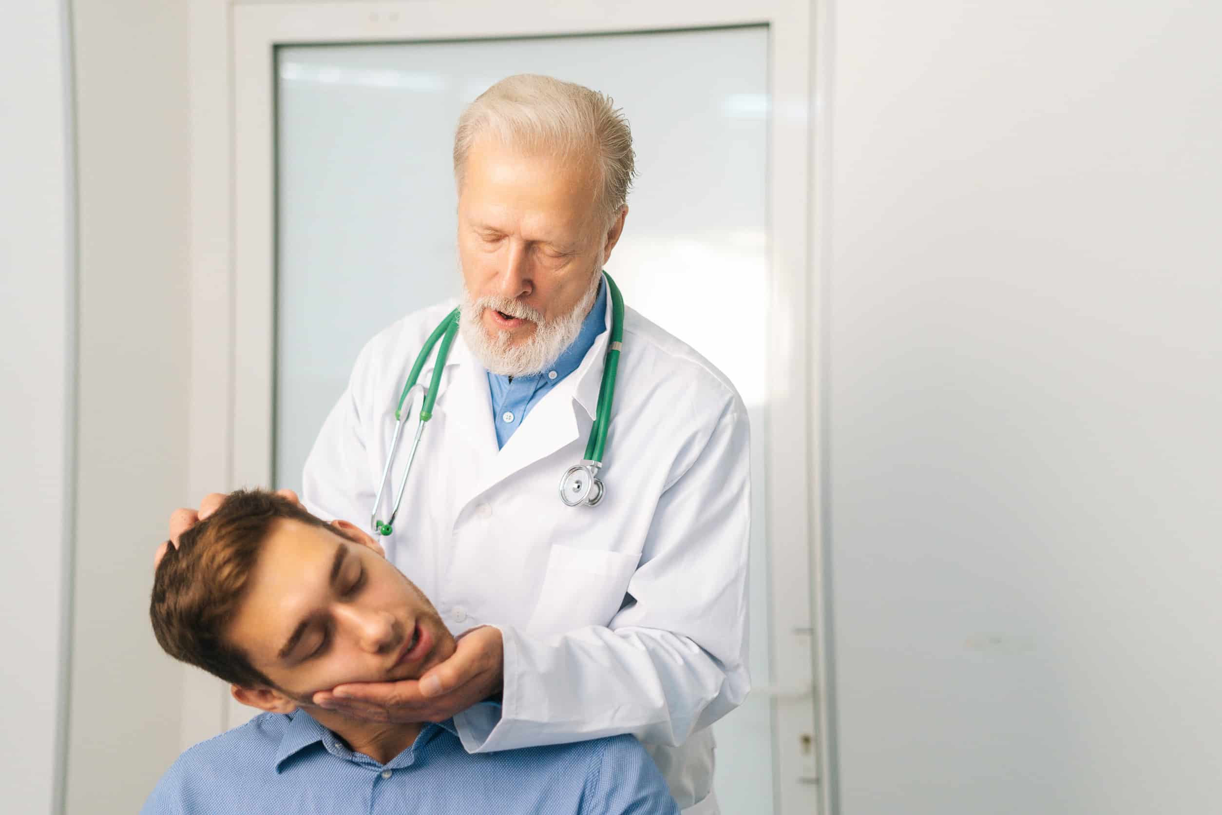 Doctor examining a crash victim at a medical clinic in Dallas Texas